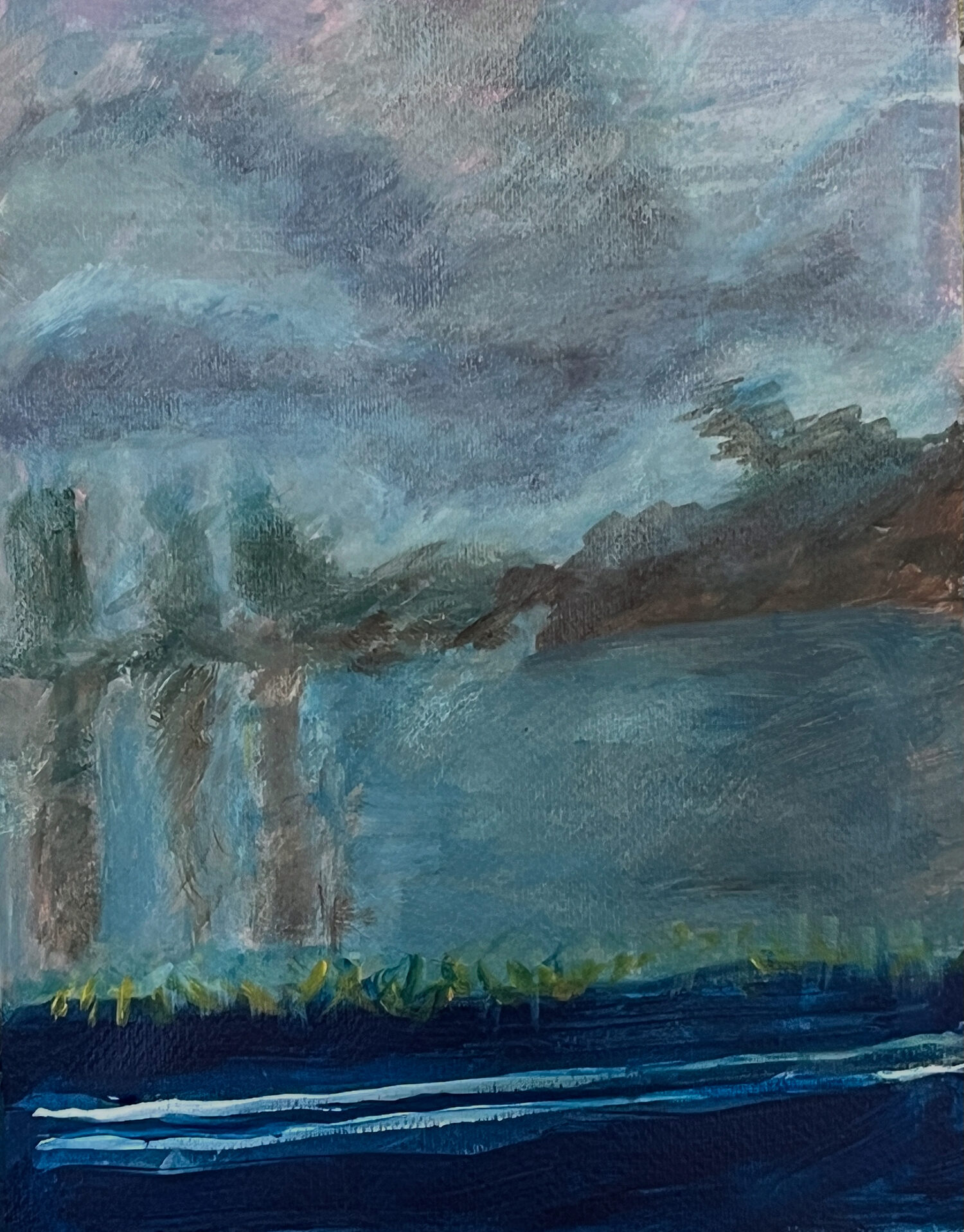 Moody seascape with soft blue tones and blurred horizon.